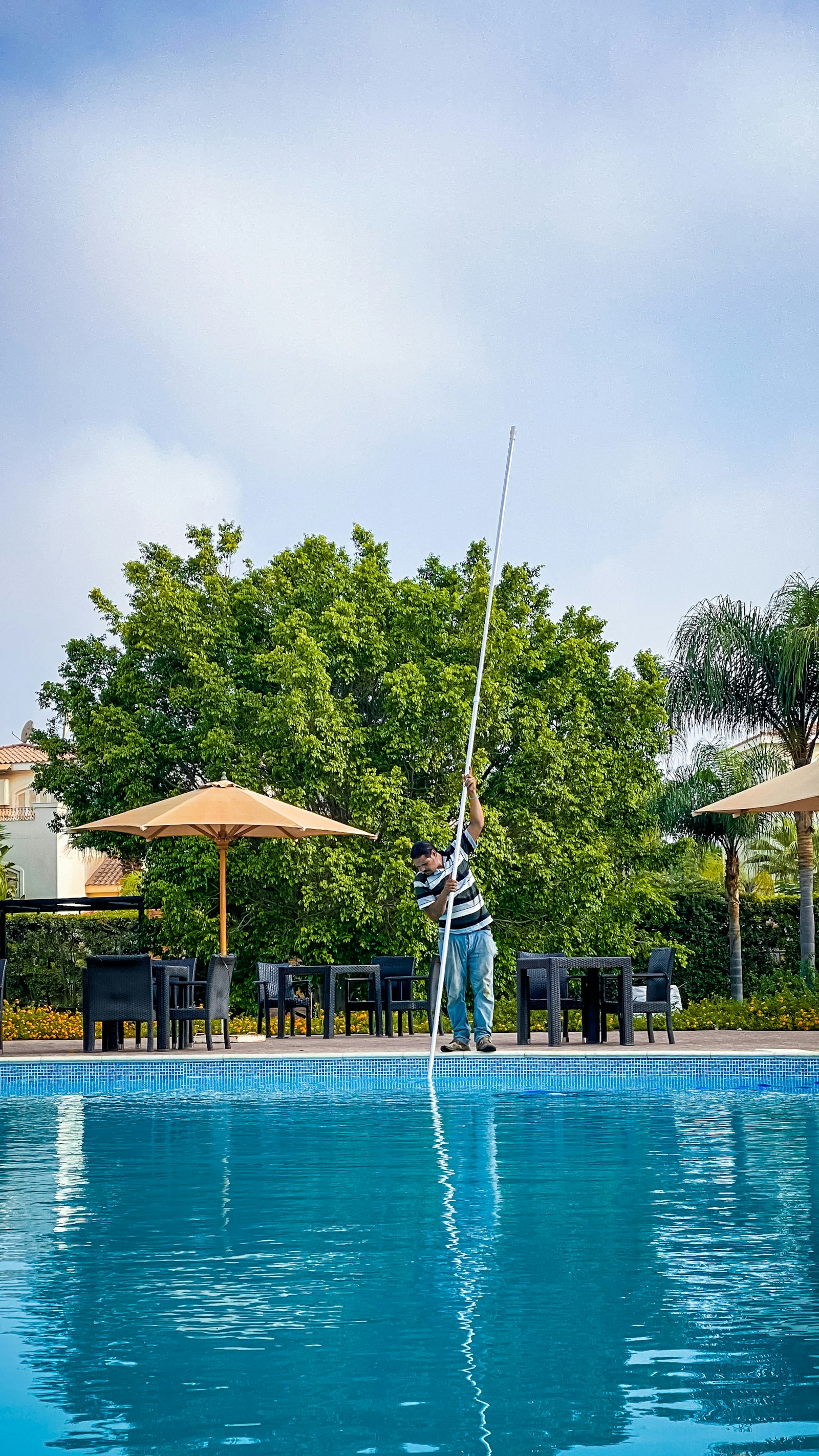 Pool maintenance with a long cleaning pole